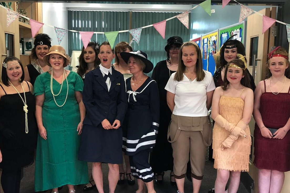 A group of people in 1930's costumes