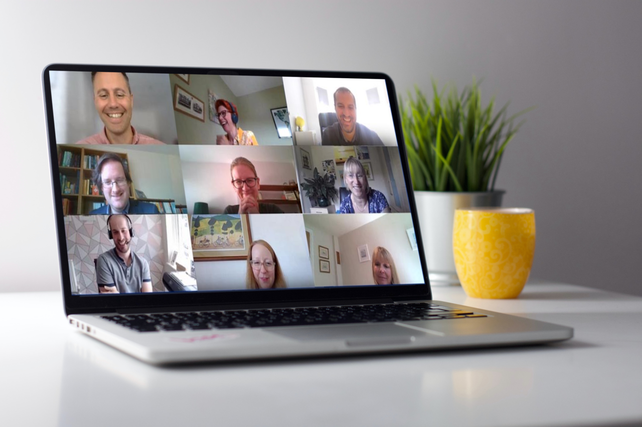 A laptop open on a Zoom meeting