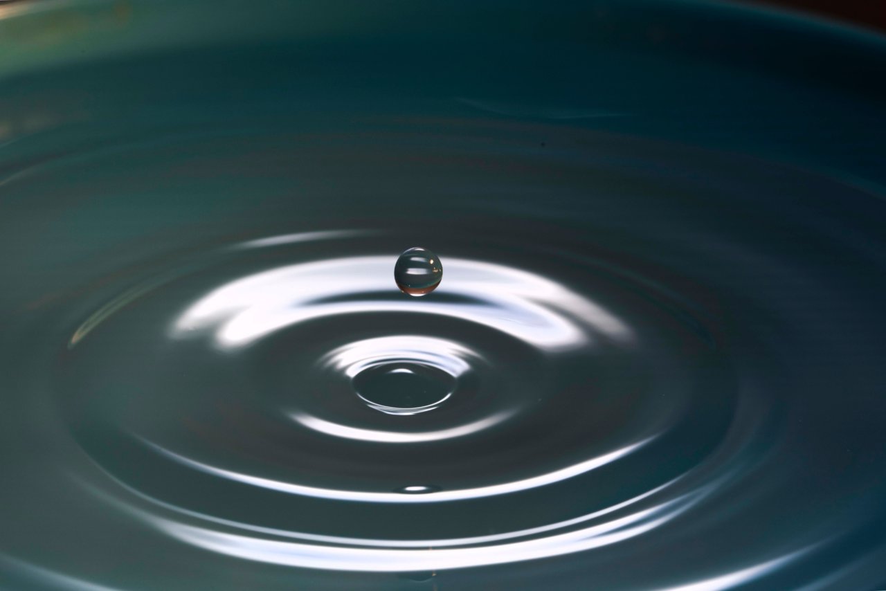 A droplet of water about to make a ripple