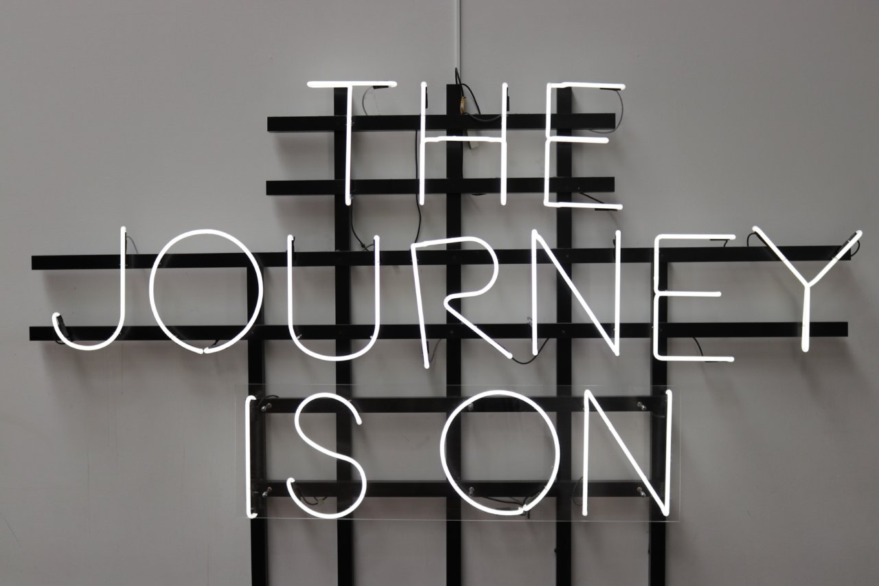 'The Journey is On' neon sign
