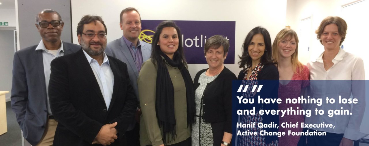 Staff at Active Change Foundation standing with Pilotlighters in a group