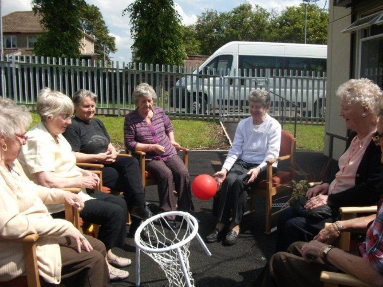 A group of people playing chair basketball