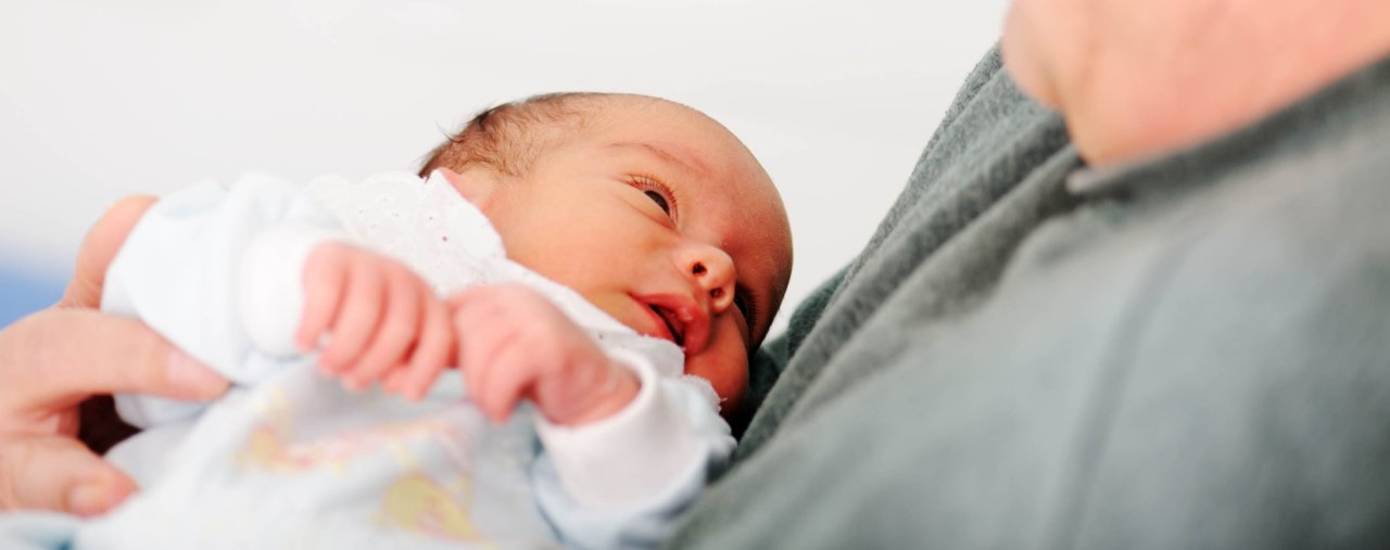 A man holding a baby