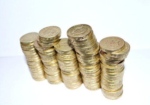 Piles of one pound coins