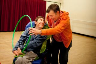 Two people having fun with a hoop